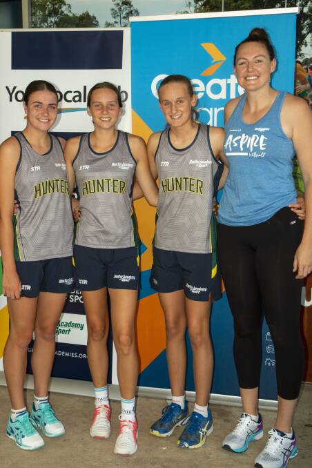 Tahlia Henry, Evie Whitton and Madison Paine with professional netballer, Sam Poolman.