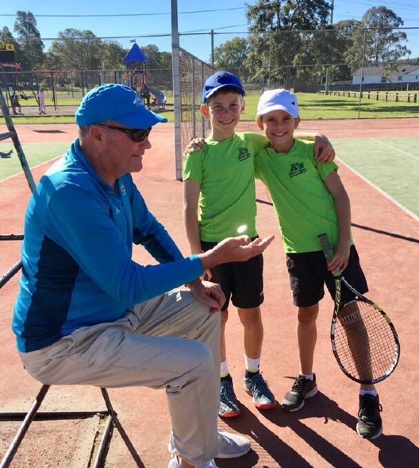 Maxim Ceccato and Hendrix McDonagh survey the coin toss before their doubles match at the 2019 NSW Country Tennis Championships.