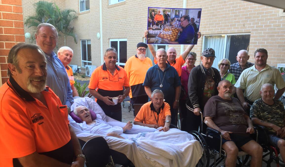 Representatives from the Forster Tuncurry Men's Shed, Myall Lakes MP Stephen Bromhead, and staff and residents of Estia Health and BaptistCare Kularoo at a meeting at Estia Tuncurry.