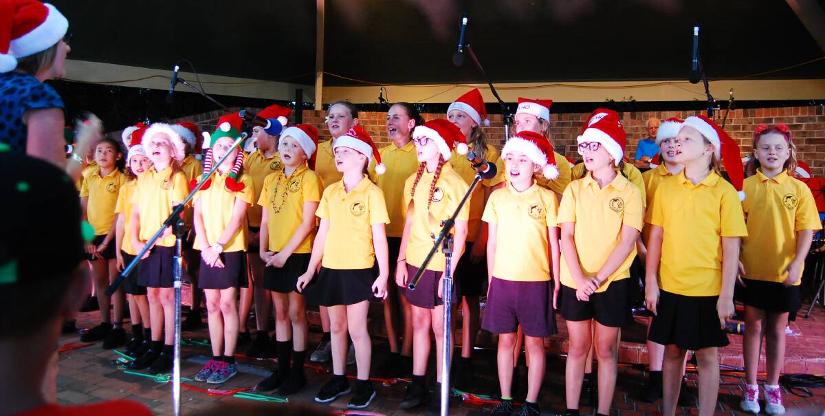 Tuncurry Public School's singing Santas were in fine voice, loud and clear, on the starry night.