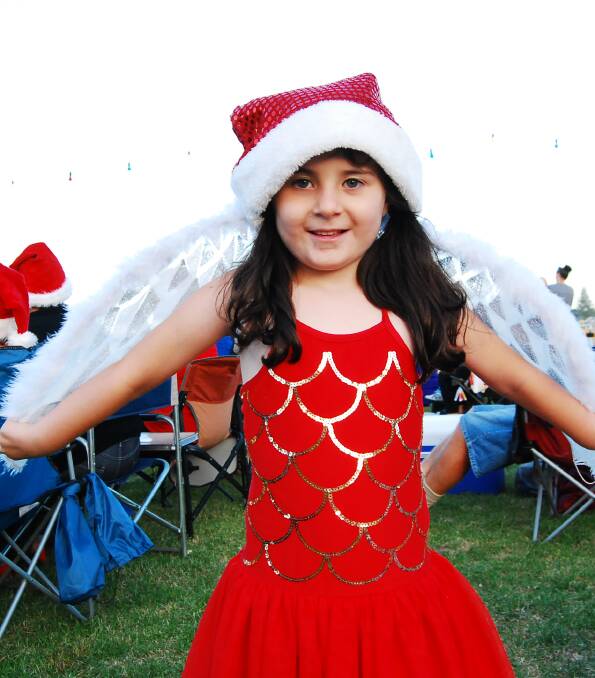 Six-year-old Isabel Allport spreads her wings for Christmas.