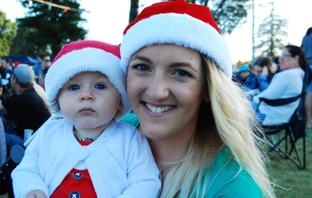 Six-month-old Remi Tull with her mother Maddi enjoy their first ever Christmas carols by candlelight together.