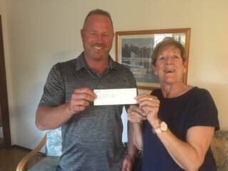 Breast Friends’ Marie Black was delighted to receive a cheque from The Rowdy Championships' Ben Mathers