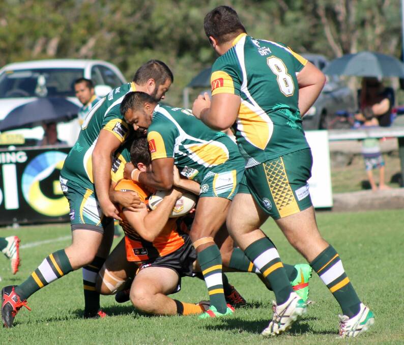 Hawks Forwards Chris Coulton and Chris Simon Wrap Up a Wingham Tigers Attacker.