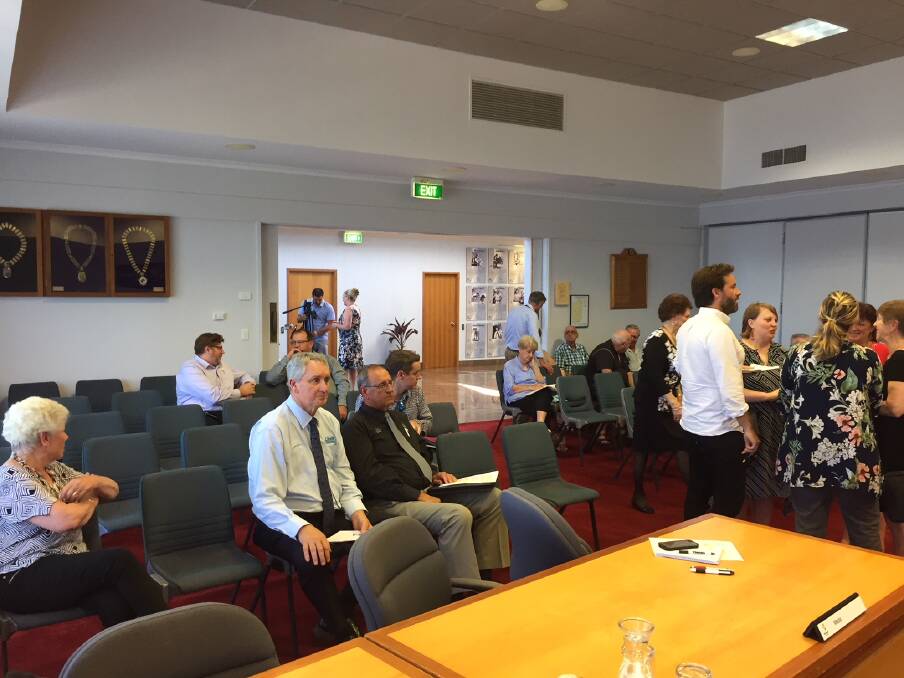 The Taree council chambers were attended by about 20 members of the public, who engaged in conversation with councillors before the meeting began.