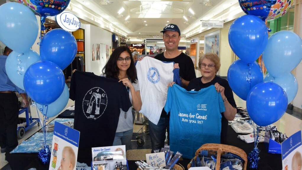 Genetic counsellor Bruce Hopper with Sydney University genetic counselling student Huafrin Kotwal and volunteer Brenda Jordan selling Jeans for Genes merchandise at Taree City Centre. Photo: Rob Douglas.

