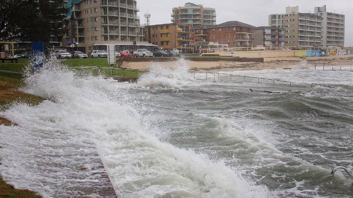 A storm in June, 2016 sent waves crashing up the beach and onto the board walk at Forster.