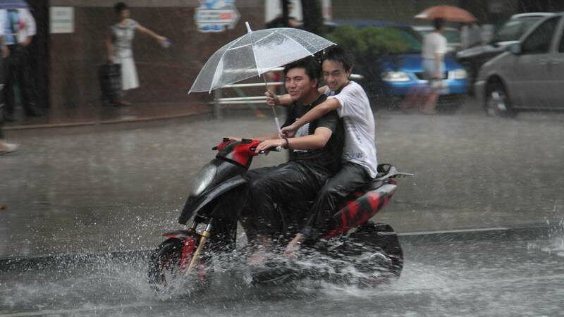 The wrong way to ride in the rain.