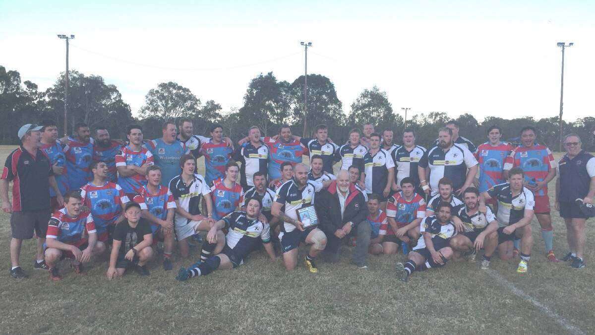 Manning River Ratz and Old Bar Clams with Ratz coach Jake Maurirere holding the Charlie Crook Shield beside rugby legend Richard Crook. 