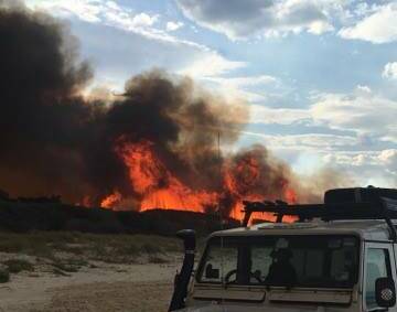 Last year there were a number of bushfires across the Great Lakes region. This photo was taken by Emily Drysdale at Tuncurry Beach last September.