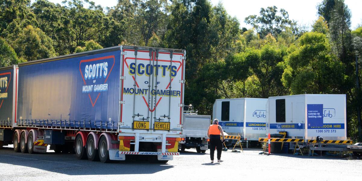 The two vans at Taree South Service Centre where truck drivers get tested for COVID. 