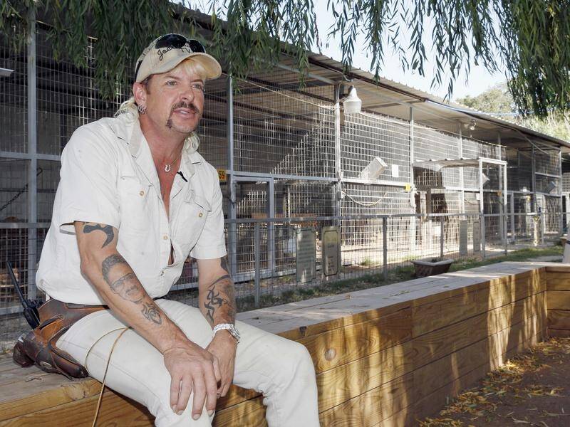 Joe Exotic's prison term on a murder-for-hire conviction has been shortened by one year.