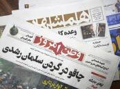 The main headline of Vatan Emrooz says "Knife in the neck of Salman Rushdie". (AP PHOTO)
