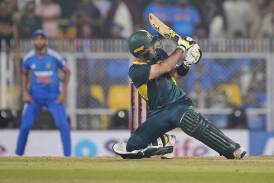 Glenn Maxwell hits a six in another incredible matchwinning innings, blasting 104no off 48 balls. (AP PHOTO)