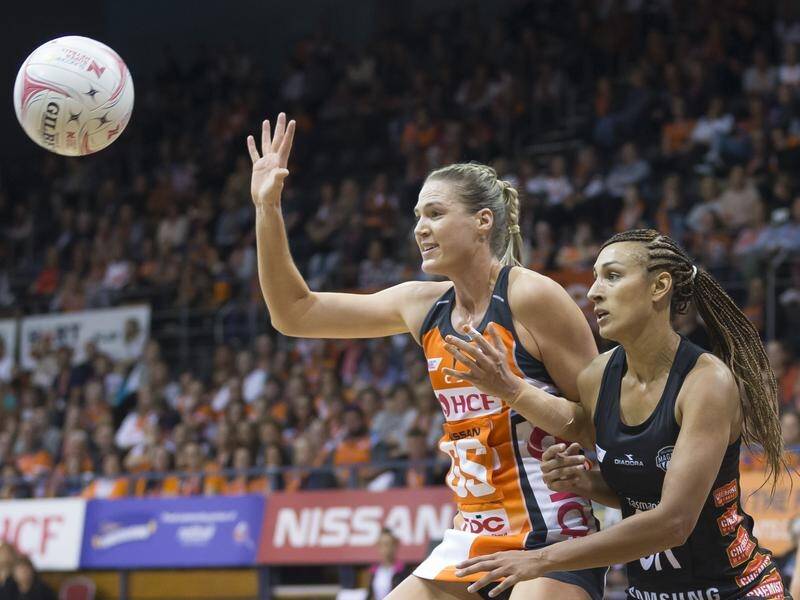 Caitlin Bassett (L) has led the Giants to their first win of the Super Netball season.