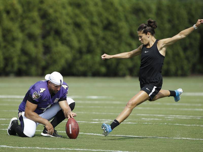 High-profile soccer player Carli Lloyd says she still wants to pursue a career in the NFL.