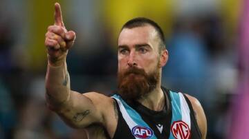 Charlie Dixon scored his 300th goal as Port Adelaide held on for a two-point win over Gold Coast.