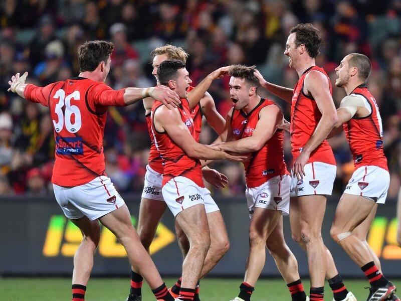 Essendon solidified their place in the AFL's top eight with a 21-point win over the Adelaide Crows.