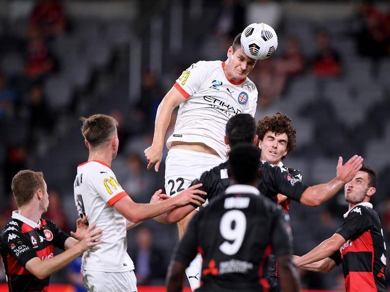 Melbourne City's Curtis Good heads the ball just over the bar in their 2-0 win over the Wanderers.