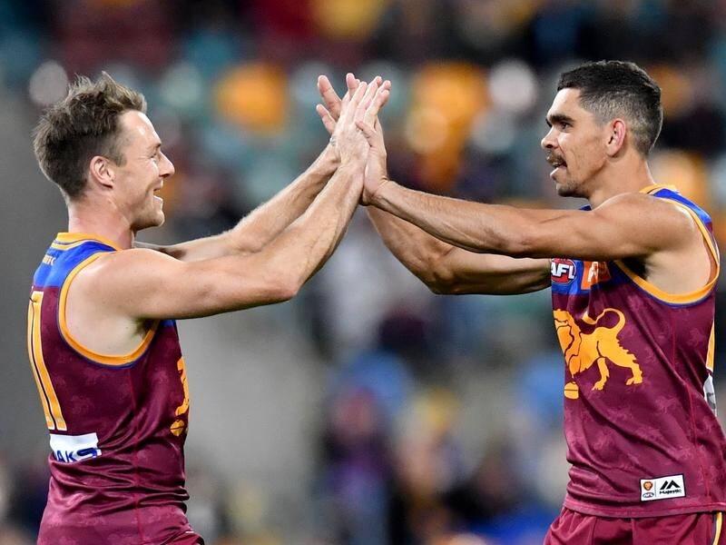 Charlie Cameron (r) and Lincoln McCarthy (l) celebrate another goal for Brisbane.