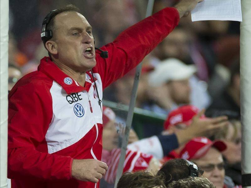 Sydney Swans mentor John Longmire has played down talk of joining North Melbourne in the AFL.