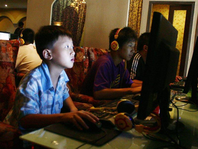 Chinese regulators have cut the amount of time those under 18 can play online games.