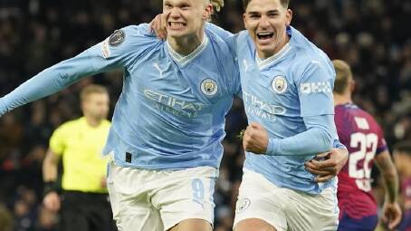 Erling Haaland (L) and Julian Alvarez (R) both scored in Manchester City's 3-2 win over RB Leipzig. (AP PHOTO)