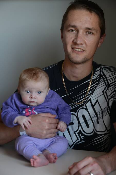 FIGHTING SPIRIT: Dwayne Gumbleton with his daughter Lilly-Ann Rose. Dwayne is currently undergoing rehabilitation at Forster Private Hospital after suffering a hypoxic brain injury as a result of an electric shock on a job site earlier this year.   