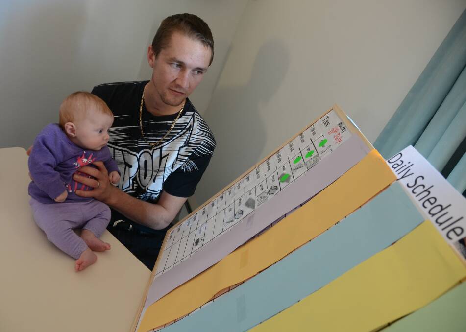 FIGHTING SPIRIT: Dwayne Gumbleton with his daughter Lilly-Ann Rose. Dwayne is currently undergoing rehabilitation at Forster Private Hospital after suffering a hypoxic brain injury as a result of an electric shock on a job site earlier this year.  