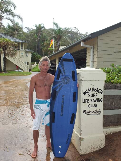 TO THE RESCUE: Palm Beach Surf Life Saving Club member Adriaan van der Wallen with his daughter’s nipper board which he used to rescue nine of the 12 people in trouble at the Tuncurry Rockpool. 
 