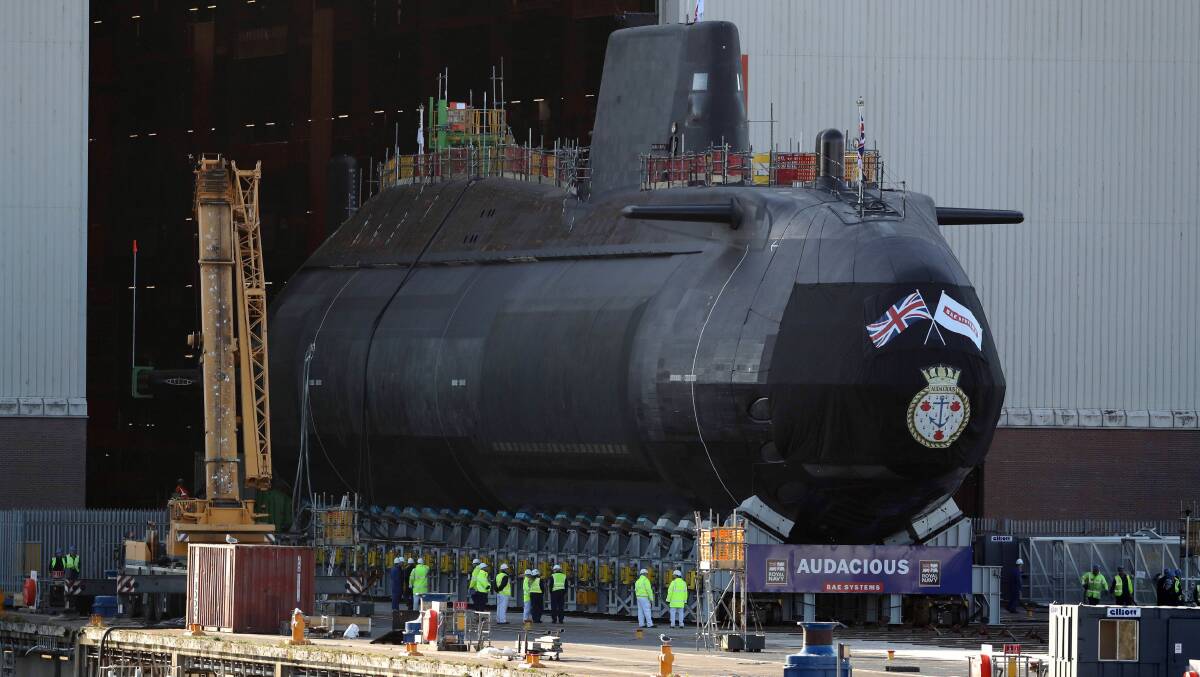 The HMS Audacious, a British Astute-class nuclear submarine, exits its indoor shipbuilding complex at BAE Systems in Burrow-in-Furness. Picture: Getty Images