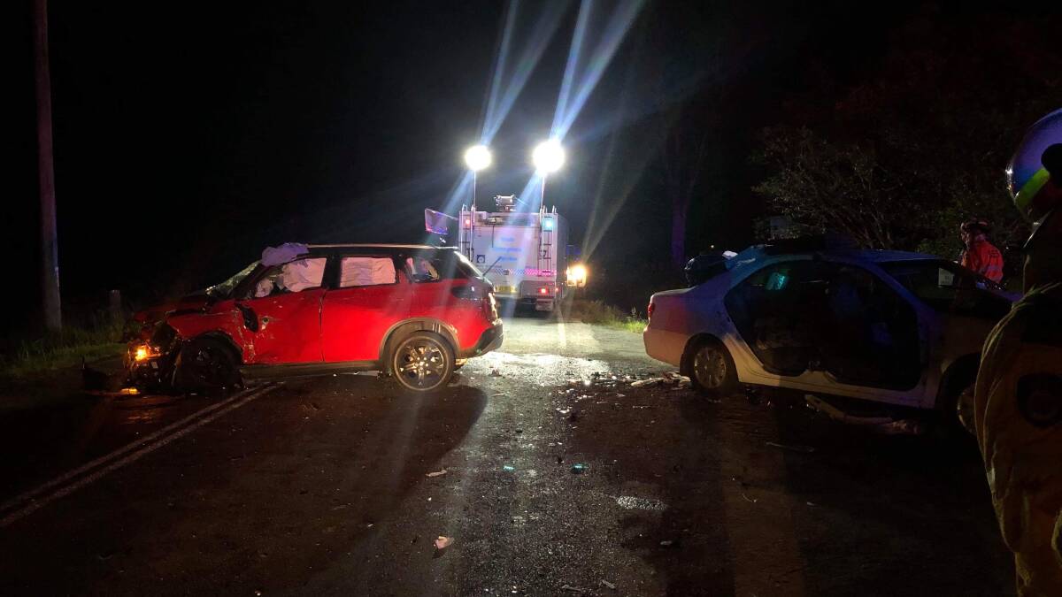 Emergency response: The crash on the Bucketts Way on Friday night, which left three people trapped. Picture: Port Stephens SES