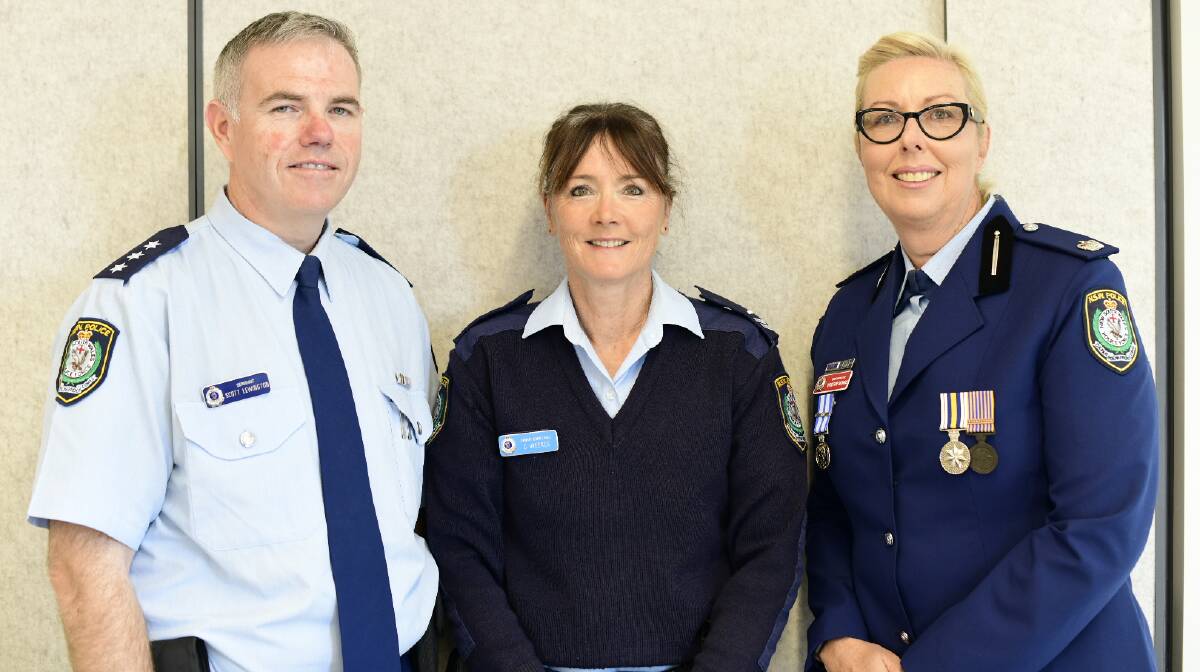 Sergeant Scott Lewington with Cassandra and chief inspector Christine George at a morning tea. Photo: supplied.