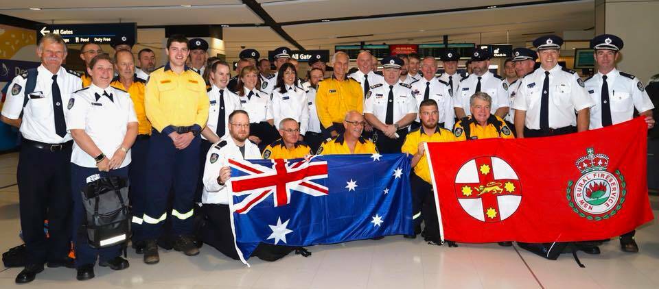 Ready for action: The Australian contingent of Rural Fire Service personnel before their flight to the US to battle bushfires.
