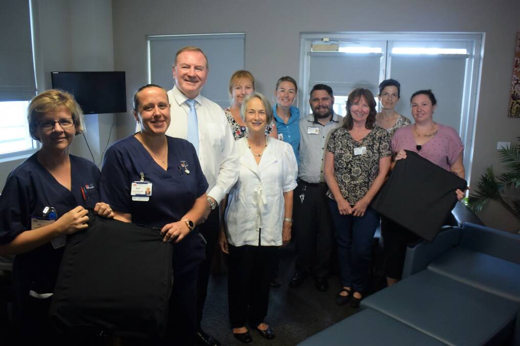 Member for Myall Lakes Stephen Bromhead, Manning Valley Push 4 Palliative chair Judy Hollingworth, Manning Hospital general manager Jodi Nieass and palliative care staff welcomed the new equipment. Photo: Rob Douglas. 