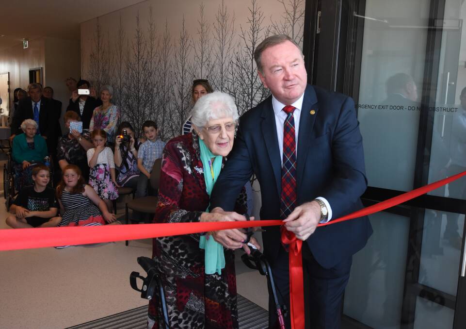Official opening: Nita Reed and Member for Myall Lakes Stephen Bromhead cut the ribbon to the new outpatients building. Photo: Scott Calvin.
