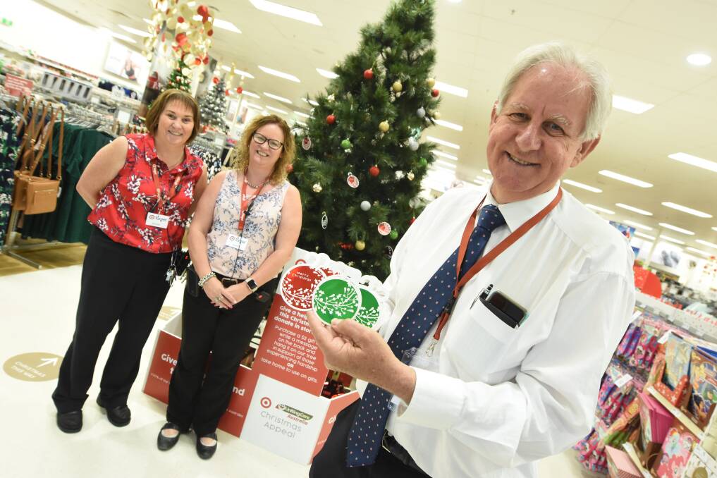 Christmas joy: Target Taree's Megan West and Kerry Fischer with Pastor David Freeman at the launch of the appeal. Photo: Scott Calvin