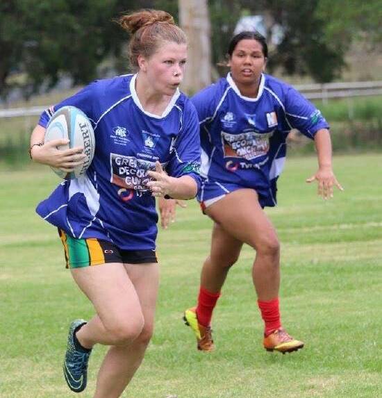 Hayley Dunk charges the ball up for Wallamba women's sevens side. 