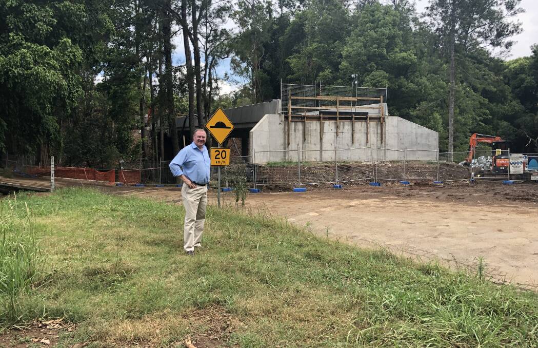 Member for Myall Lakes Stephen Bromhead with the under construction Bobin Bridge.