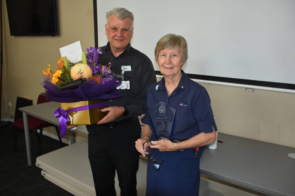 Manning Base Hospital nursing and midwifery acting director, Paul Townsend thanks Maria Olsen for her service.