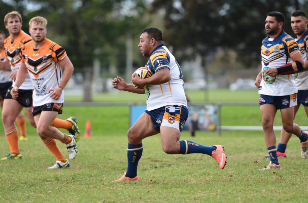 A Macleay Valley Mustangs forward carries the ball forward against the Wingham Tigers earlier this season.