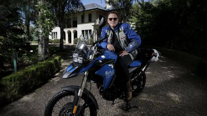 Tim Mathieson will be riding a BMW from Kirribilli House to The Lodge to raise funds for a Cambodian orphanage combating child slavery. Photo: Andrew Meares