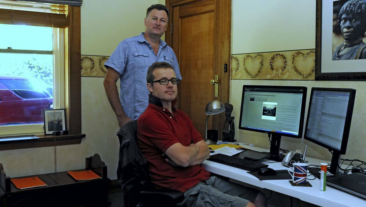 Managing senior international media roles while living at home in Northern Tasmania are Reuters columnist Clyde Russell, of Legana, and editor Dean Yates, of Evandale. Picture: NEIL RICHARDSON