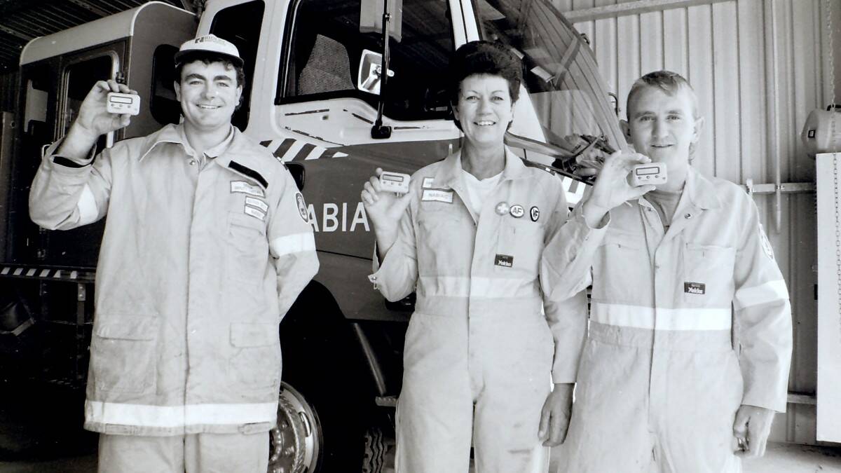 THROWBACK THURSDAY: Nabiac Rural Fire Service brigade members Nathan Birchall, Sandra Birchall and Mark Styles with new devices to make fire call outs easier.