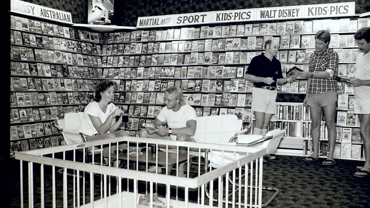 THROWBACK THURSDAY: People enjoying Gilbey's Movie Video Library in Forster 