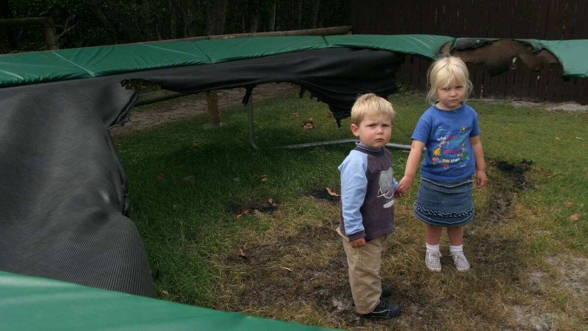 THROWBACK THURSDAY:  Finn and Saskia Kennett with the ruins of their trampoline which was once their pride and joy