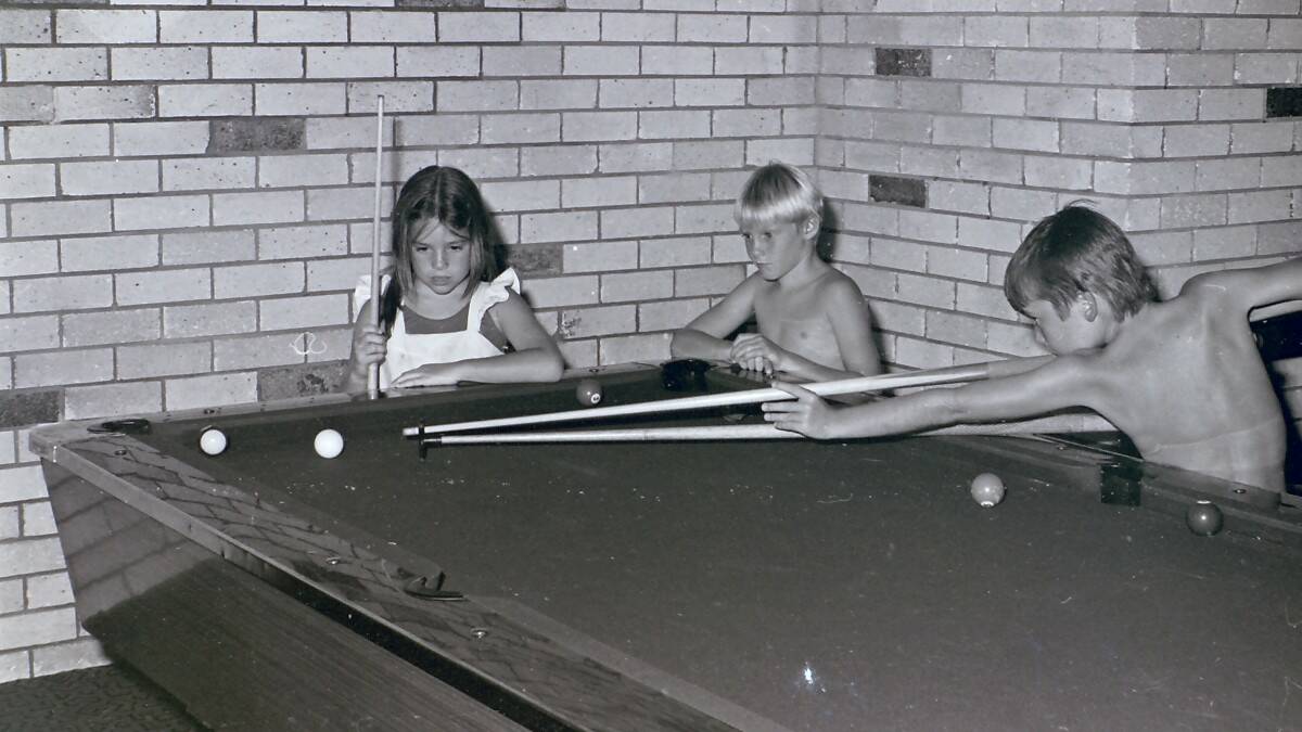 THROWBACK THURSDAY: Michelle Pallett, 9, and Mathew Pallett, 9, of Goondiwindi playing a game of pool with David Frazer, 8, of Newcastle.