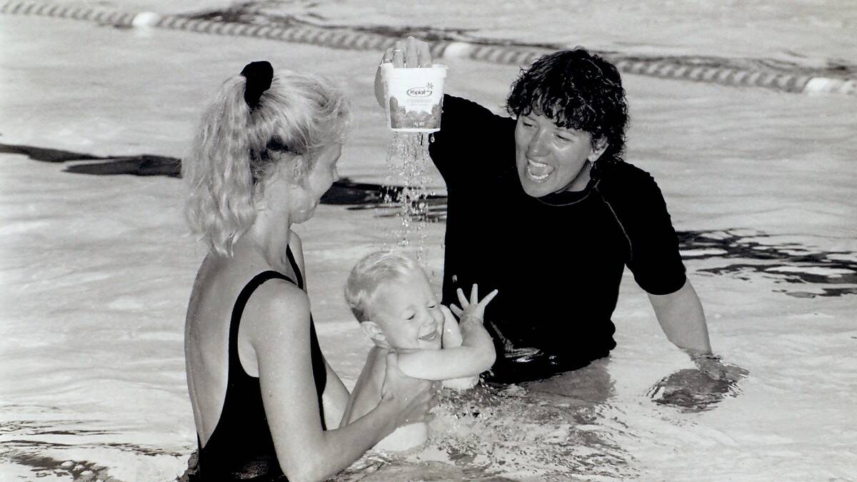 THROWBACK THURSDAY: Aron Severs with mum Cindy learning how to swim with the help of instructor Jo Coleman.