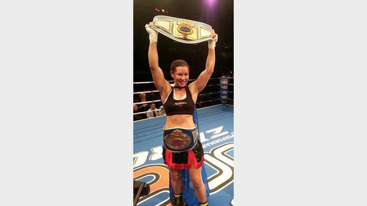 DUAL WORLD CHAMPION: Arlene ‘Angerfist’ Blencowe with the WBF and WIBA world title belts she took from ‘Diamond’ Daniella Smith in New Zealand on Thursday night.