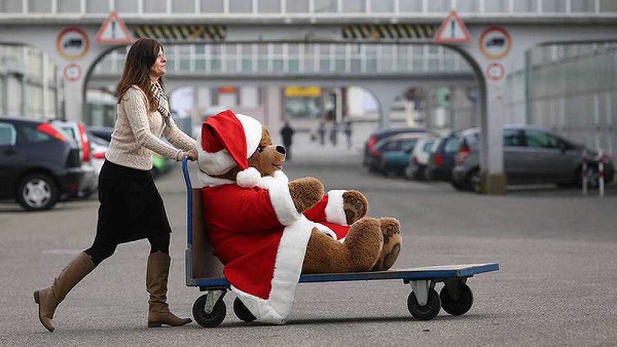 A Christmas teddy bear is wheeled along on a trolley at the Steiff stuffed toy factory in Giengen an der Brenz, Germany. Photo: Getty